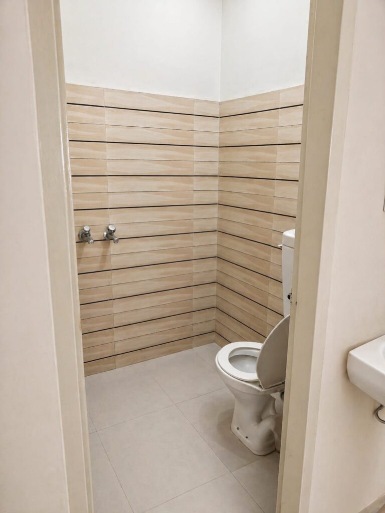 "Clean Washroom with modern fitting at Neeldhari House PG Rajpura"
